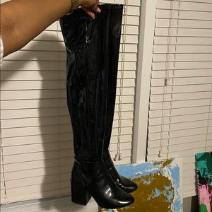 Black patent leather thigh highs. Good condition, 6.5